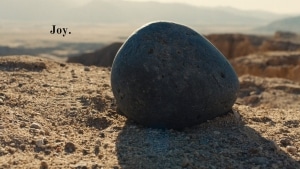 A rock looks over and beautiful but lifeless landscape on an Earth that never developed life. 